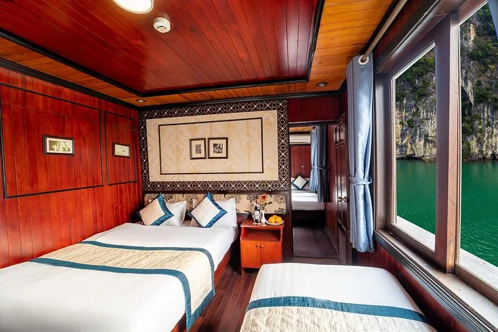 A family cabin on a cruise ship with one double and one single bed